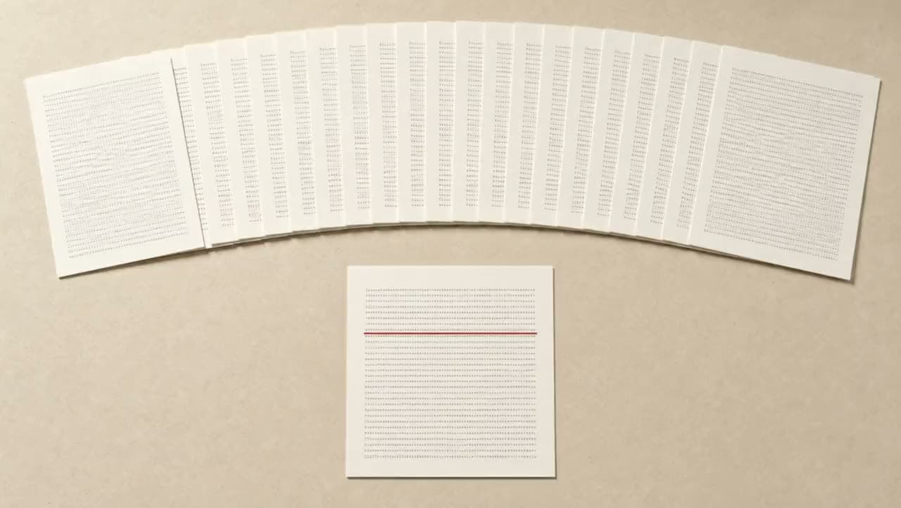 A wide arc of identical printed sheets across a desk, with one sheet pulled clear and lying alone below it, carrying a single red underline.